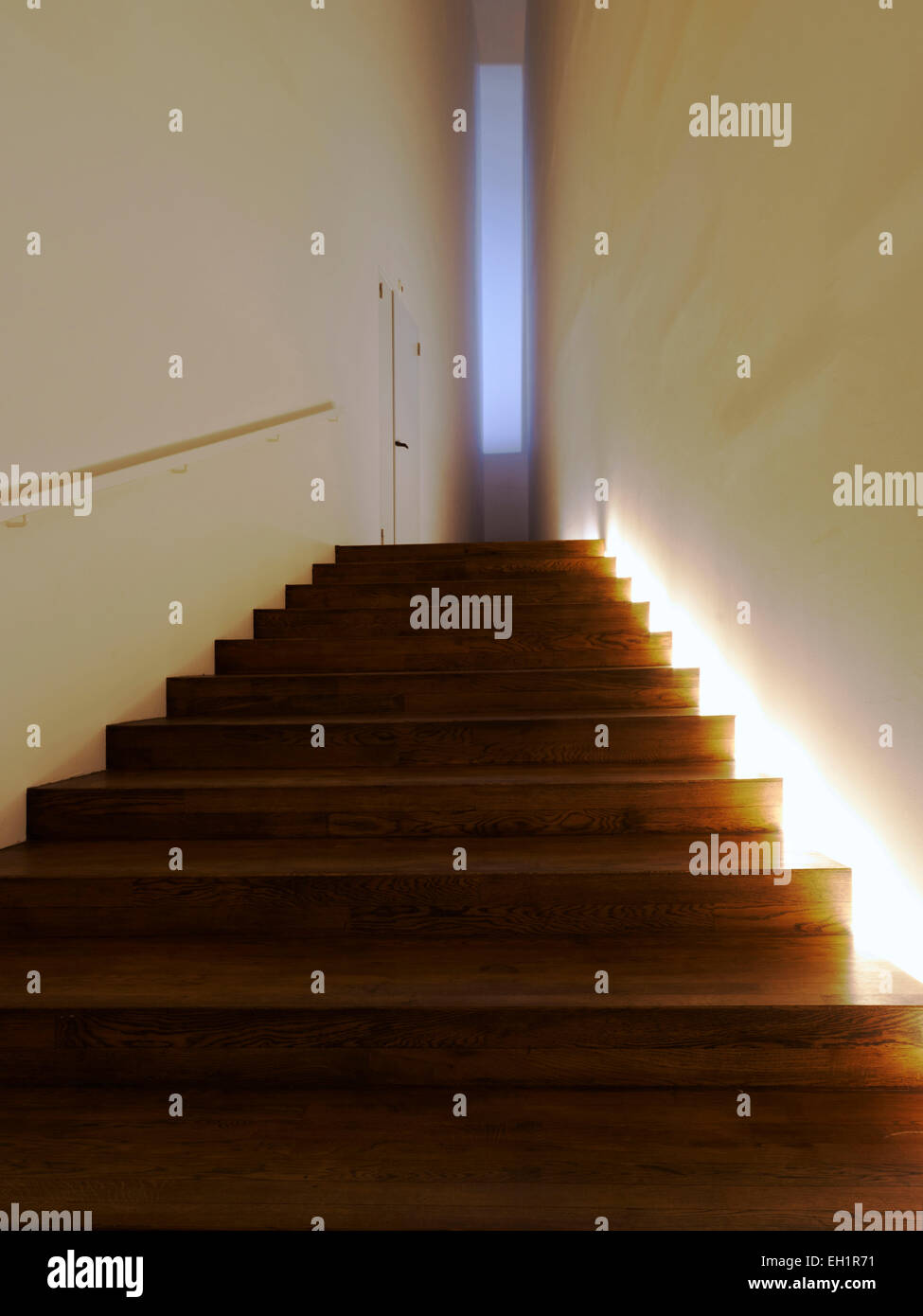 Lit wooden staircase in EYE Film Institute Netherlands, Dutch centre for film culture and heritage. Stock Photo
