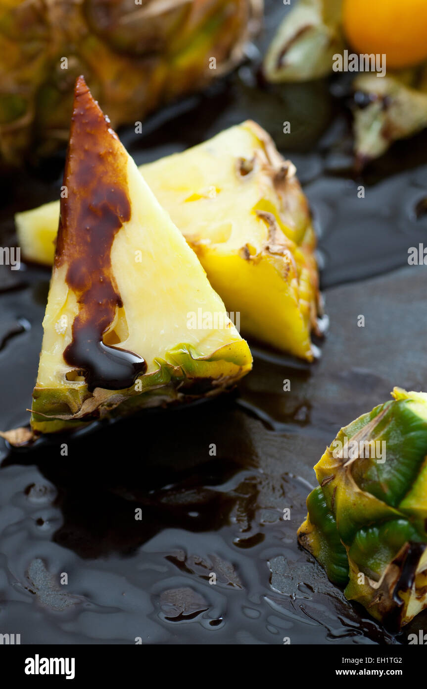 Fresh pineapple slice with melted chocolate. Stock Photo