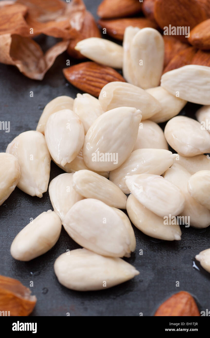 Peeled organic almonds close up. Stock Photo