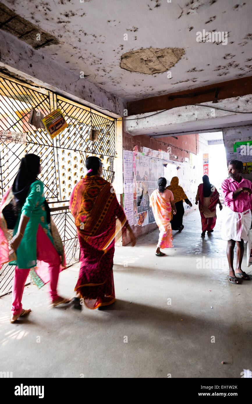 Local Indian ladies in brightly coloured dresses heading for the ferry terminal, Cochin ferry terminal Stock Photo