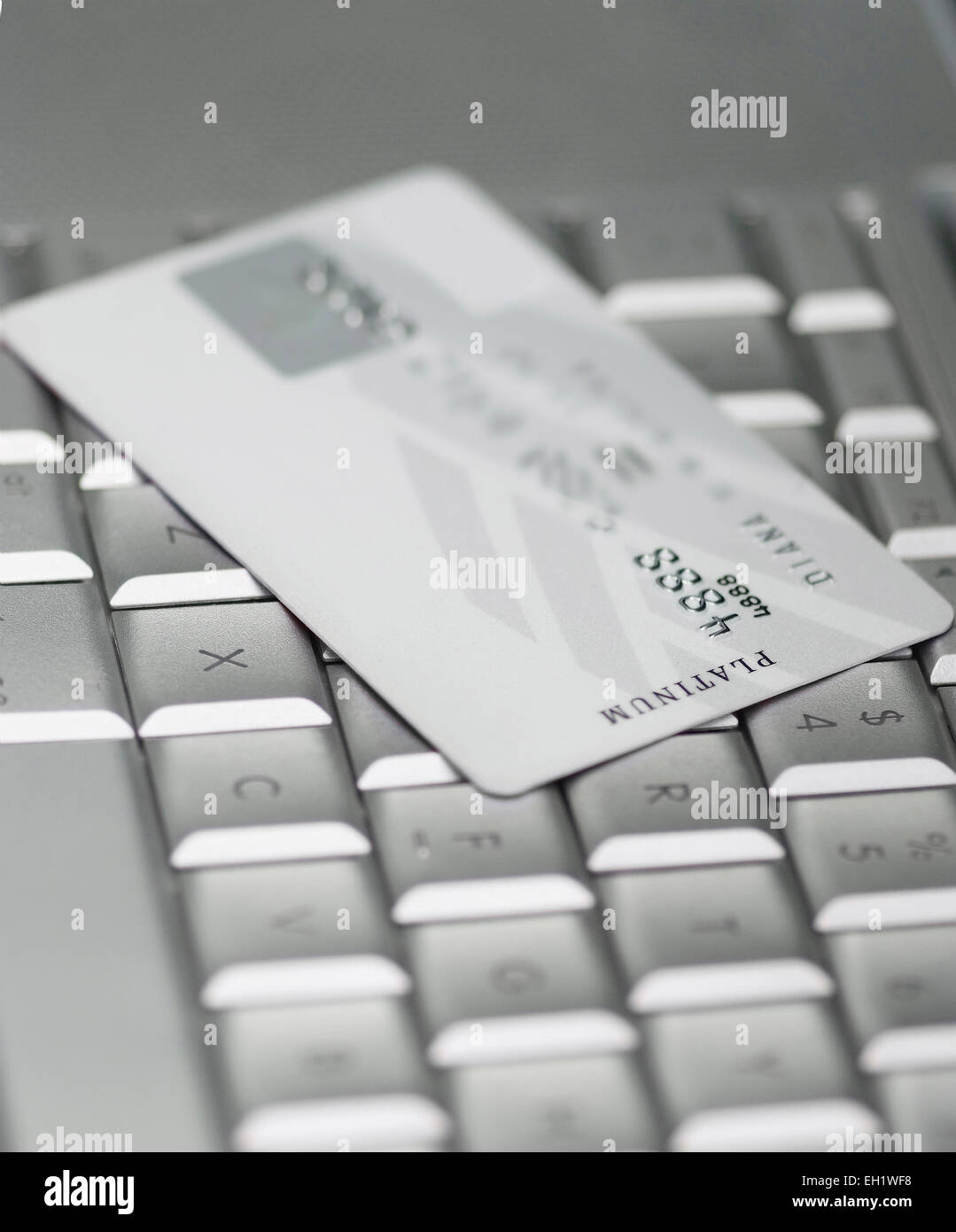 Credit card on a Mac keyboard Stock Photo Alamy