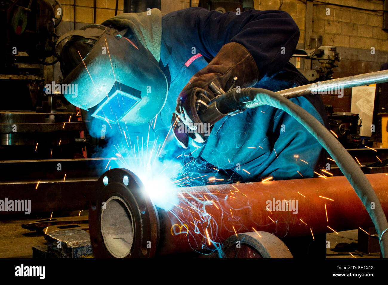Industrial welder with torch Stock Photo