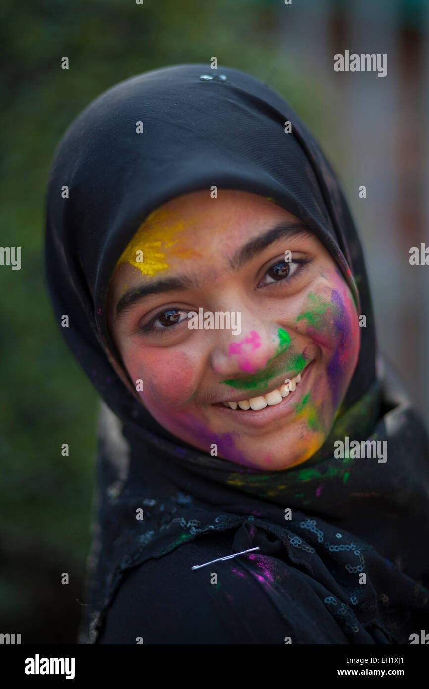 Dhaka, Bangladesh. 5th March, 2015. Muslim girl attended Dol Festival wearing hijab with their friend.The Dol Utsav, a festival of the Hindu community, is being celebrated with colored powder in the country, at the time of Holi in Dhaka.People from all ages attended this festival. Credit:  zakir hossain chowdhury zakir/Alamy Live News Stock Photo