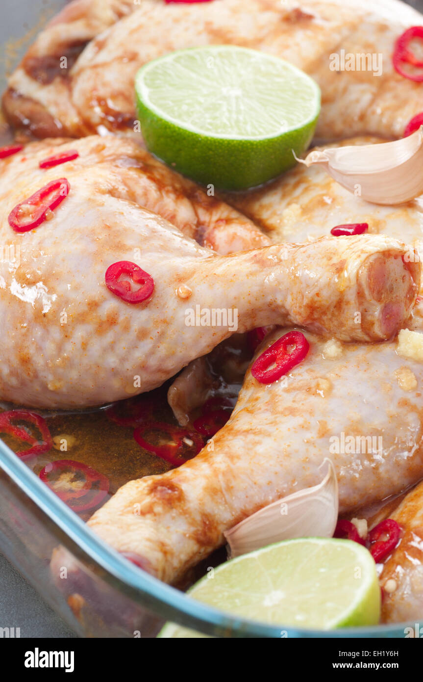Raw chicken thighs in marinade. Stock Photo