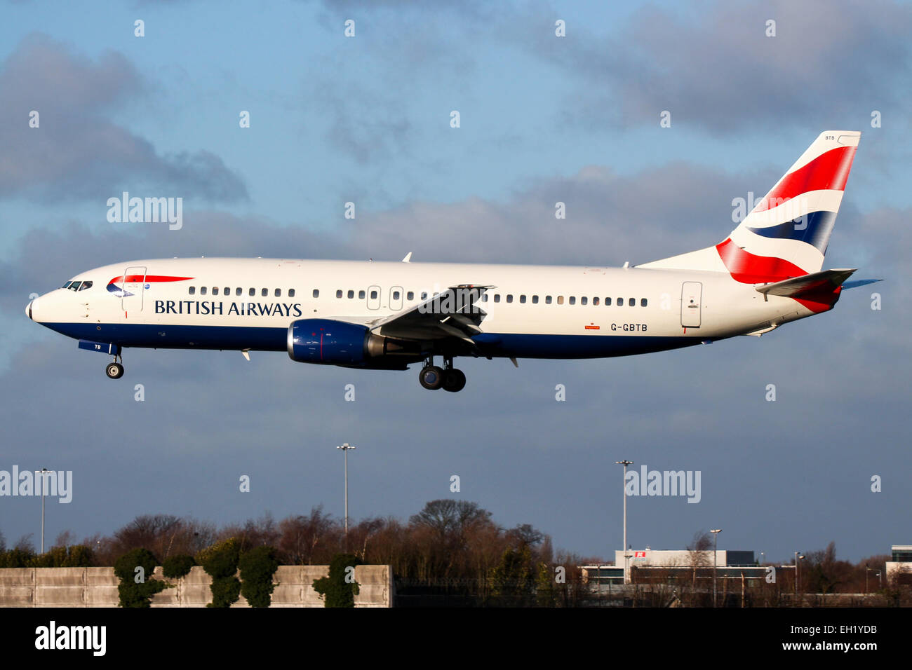 British Airways Boeing 737-400 approaches runway 23R at Manchester airport. Stock Photo