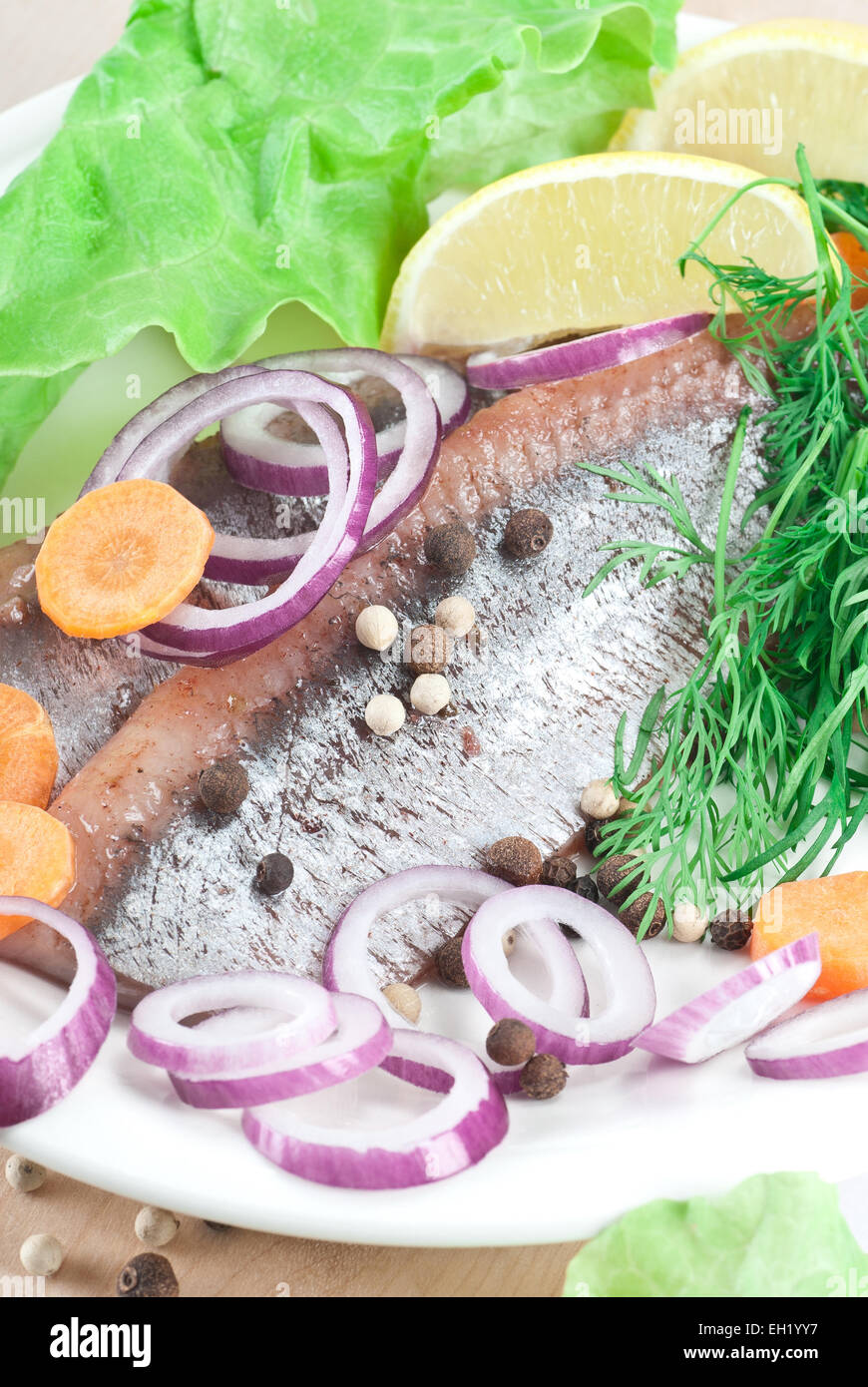 Pickled herring fillets with spanish onion and dill Stock Photo Alamy