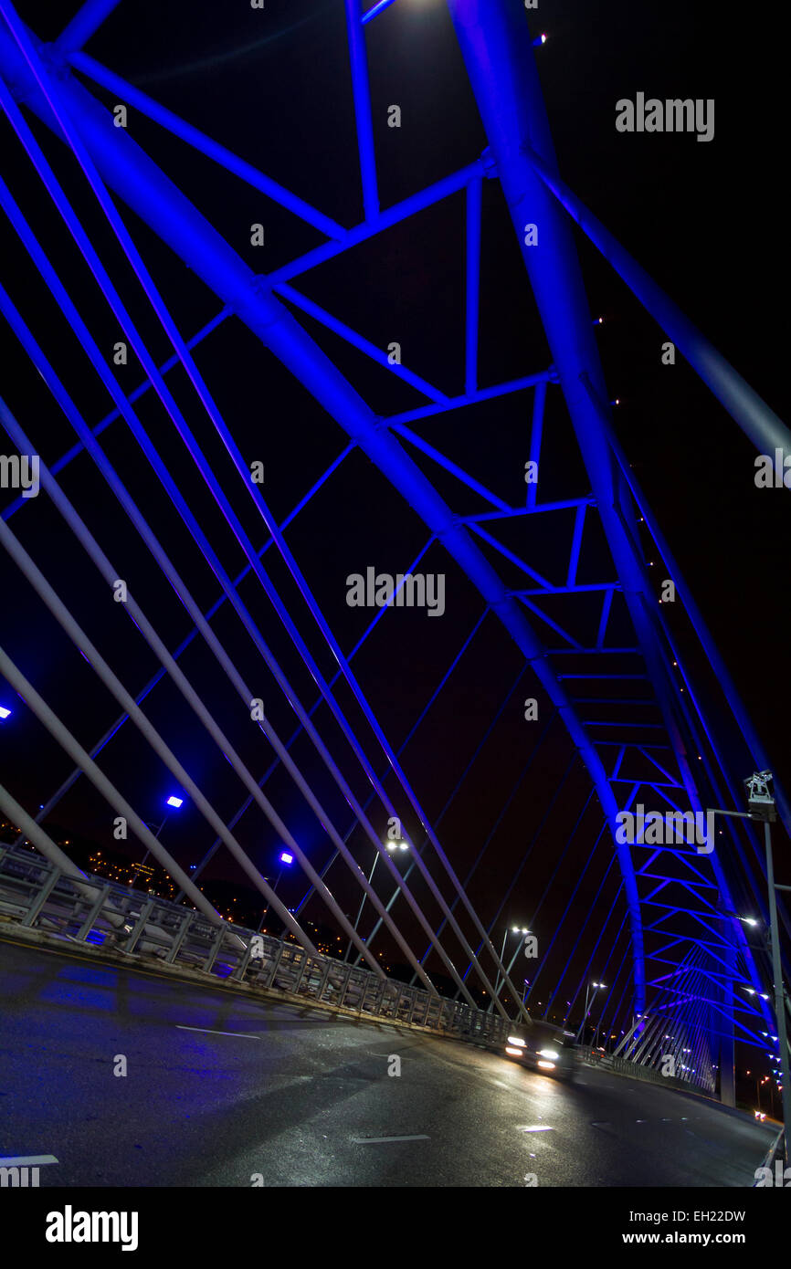 Futuristic blue light bridge at night Stock Photo