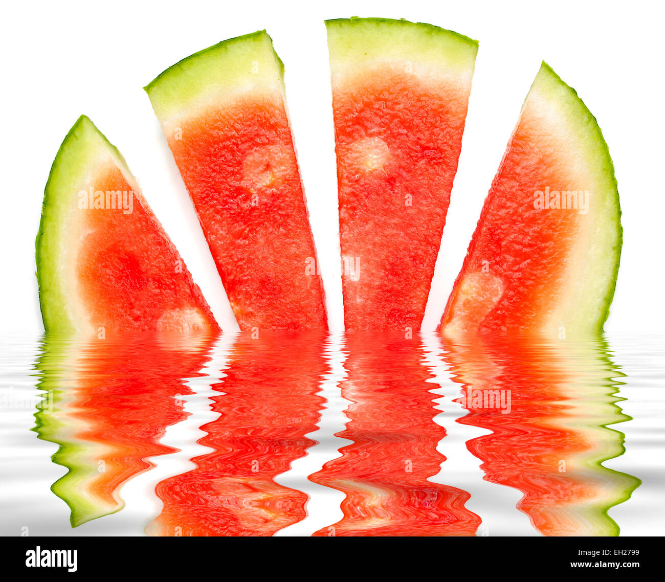 Water melon segments reflected in a digitally created pool of water Stock Photo