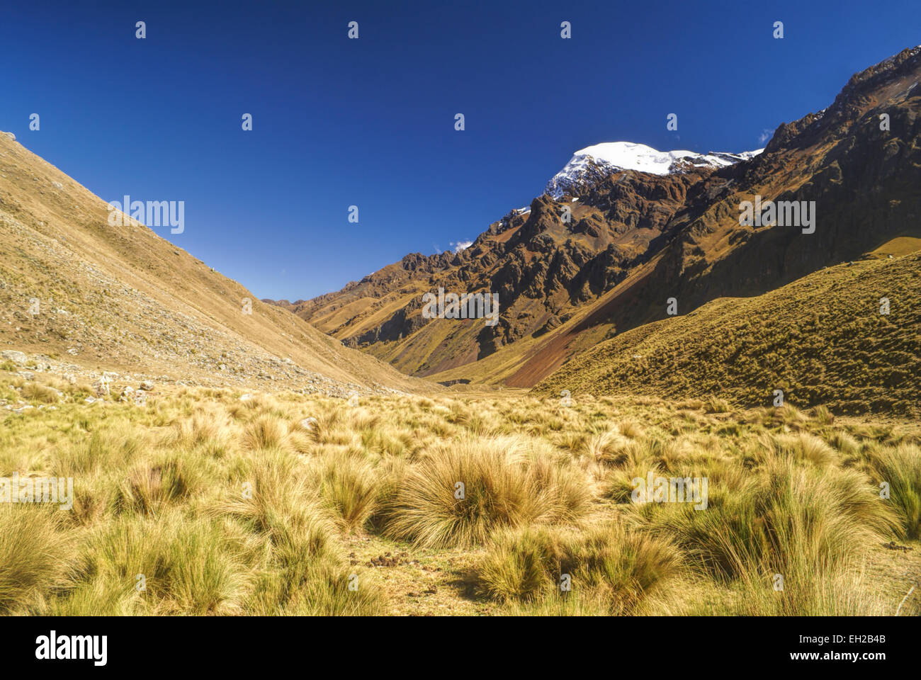 Picturesque valley between high mountain peaks in Peruvian Andes Stock Photo