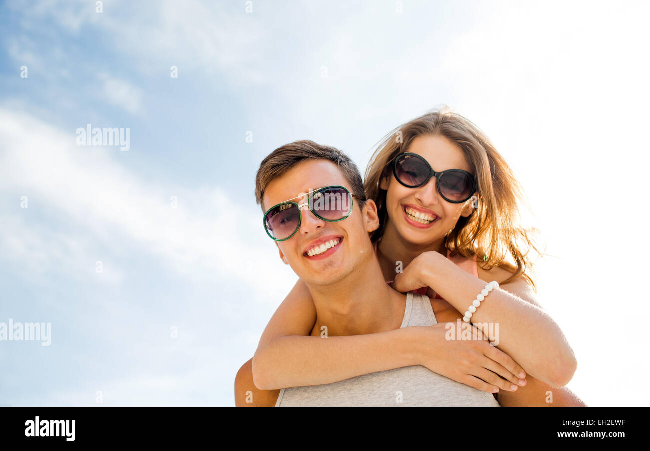 smiling couple having fun over sky background Stock Photo - Alamy
