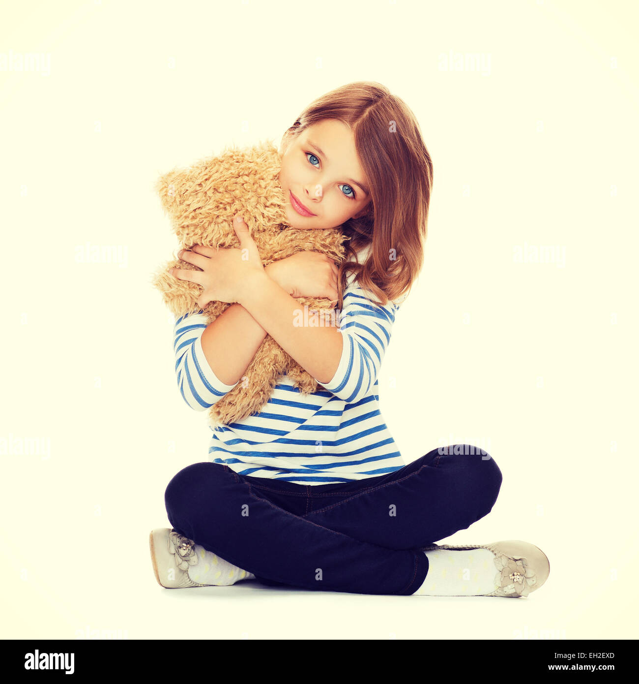 cute little girl hugging teddy bear Stock Photo - Alamy