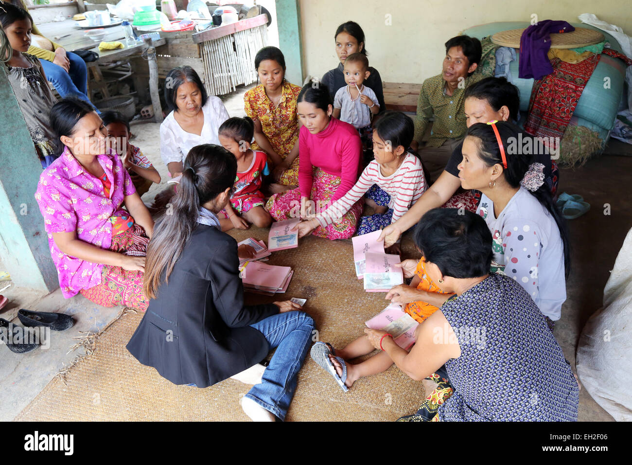Women participate in a Village Savings and Loan meeting in a village in Cambodia, Asia Stock Photo