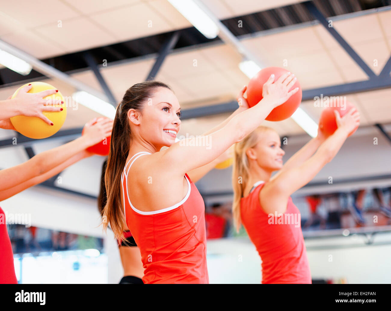 group of people working out with stability balls Stock Photo