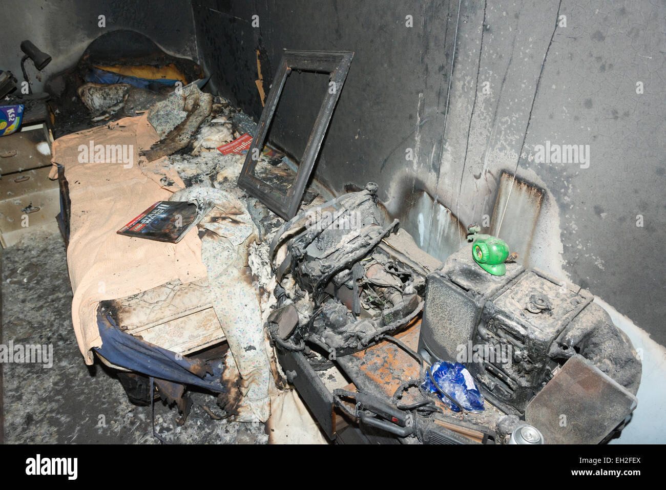 Fire damage at a charred blackened and burnt out room Stock Photo