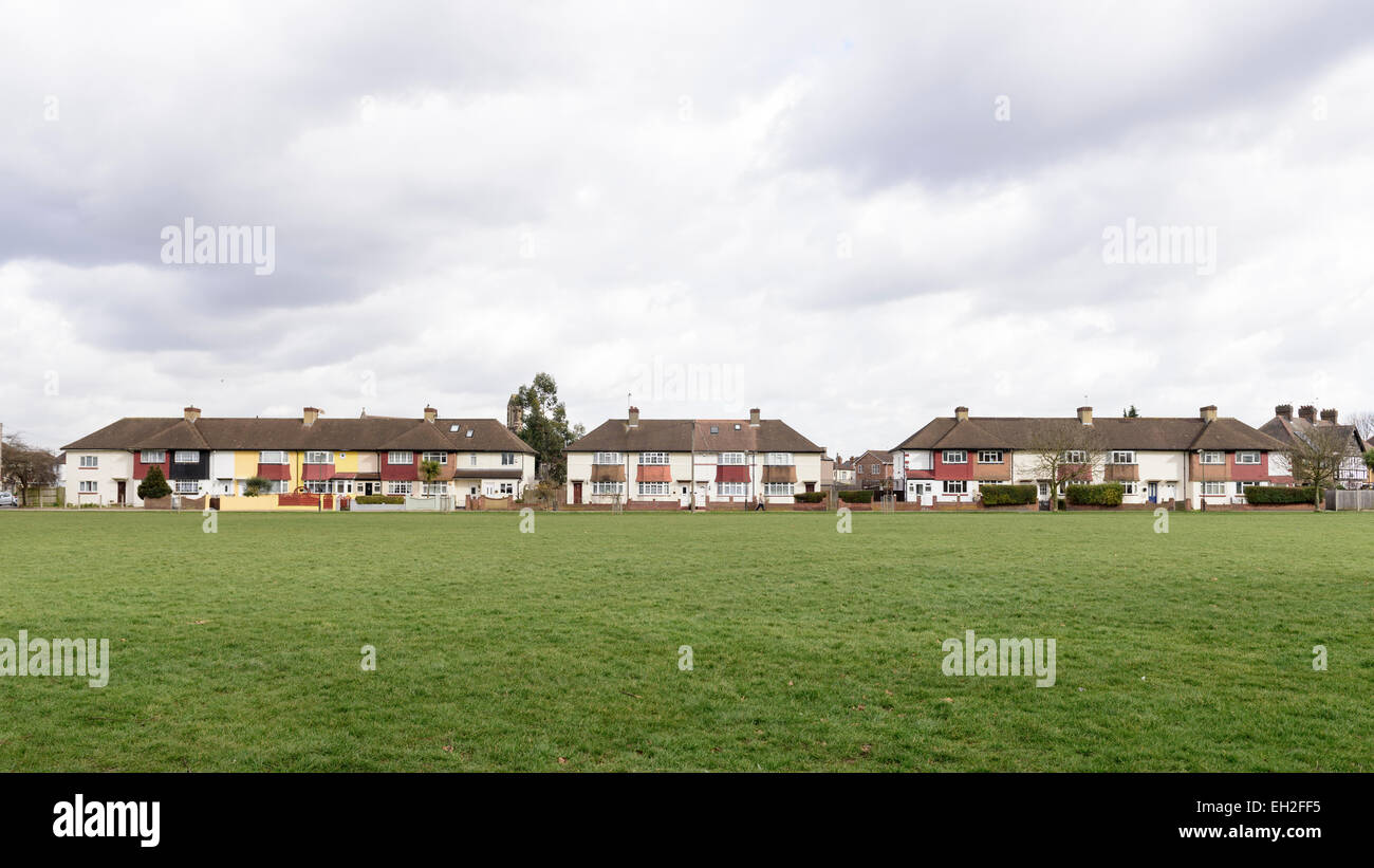 Line of semidetached and terraced housing in the South London suburb of. Typical 1930's houses built around green open space Stock Photo