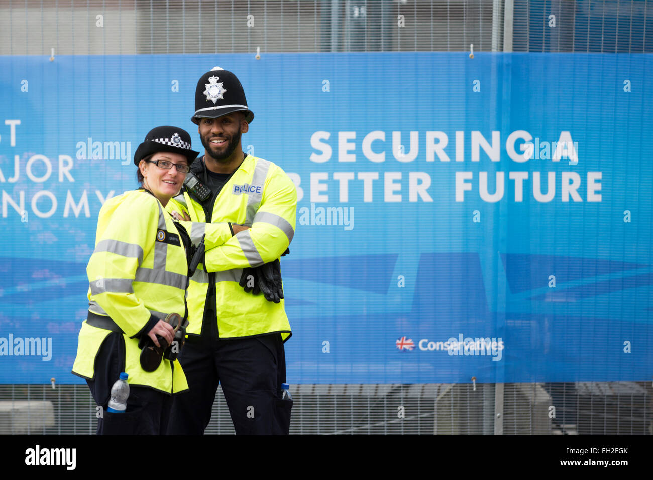 Smiling female and male police officers at the Conservative Party conference Stock Photo