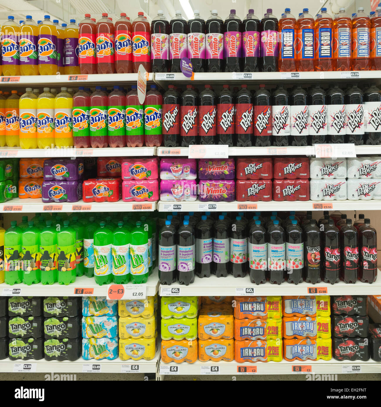 Variety of soft drinks on supermarket shelves Stock Photo Alamy