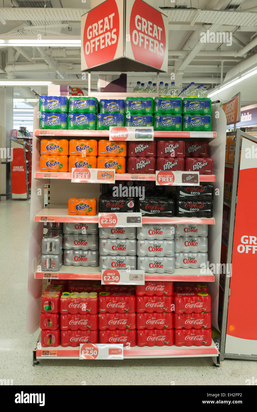 Variety of soft drinks on supermarket shelves including Coca Cola, Diet Coke and Fanta orange Stock Photo