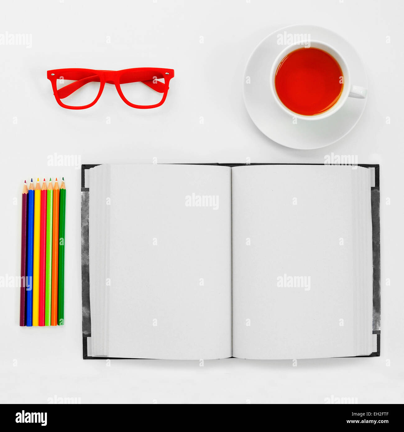 Download High Angle Shot Of A Some Colored Pencils A Blank Notebook A Pair Stock Photo Alamy Yellowimages Mockups