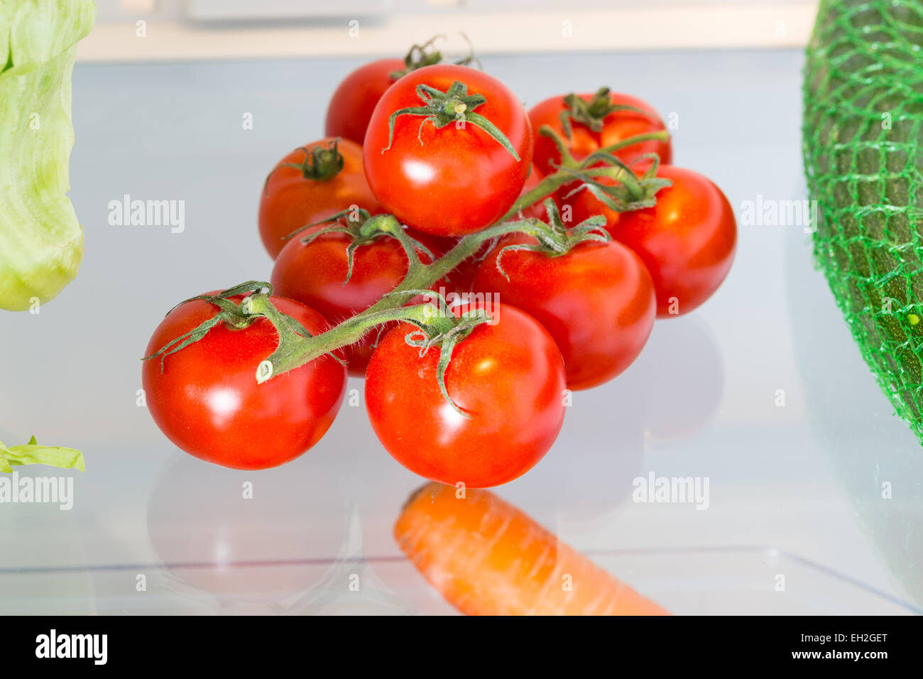 Tomatoes in the refrigerator with the door open Stock Photo Alamy