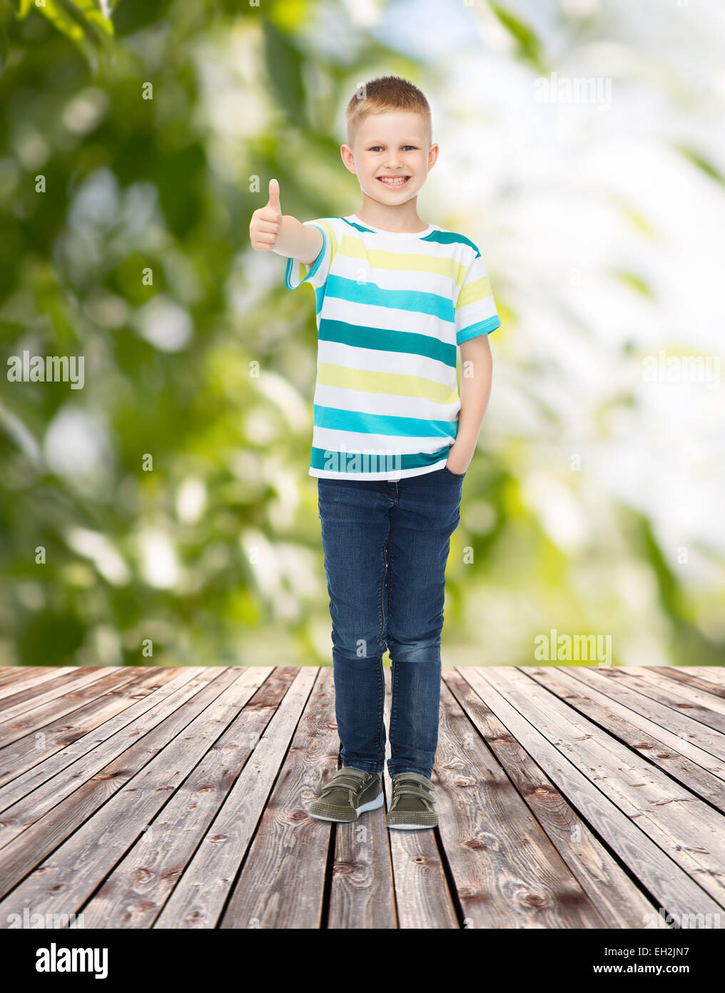 smiling little boy showing thumbs up Stock Photo - Alamy