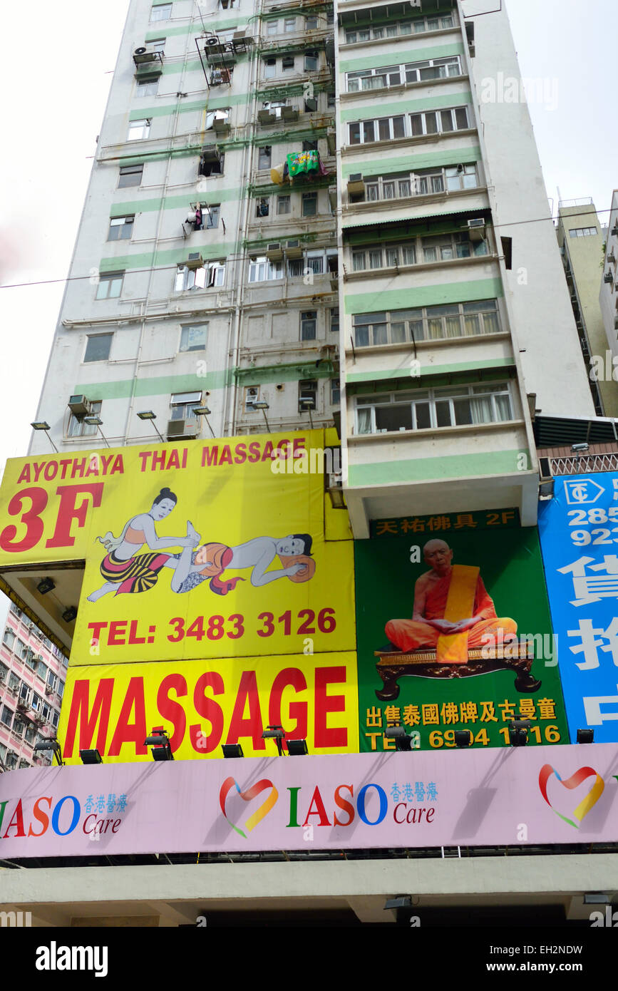 Wan Chai building in Hong Kong with lots of accommodation and large  advertisements onthe outside for Thai Massage Stock Photo - Alamy