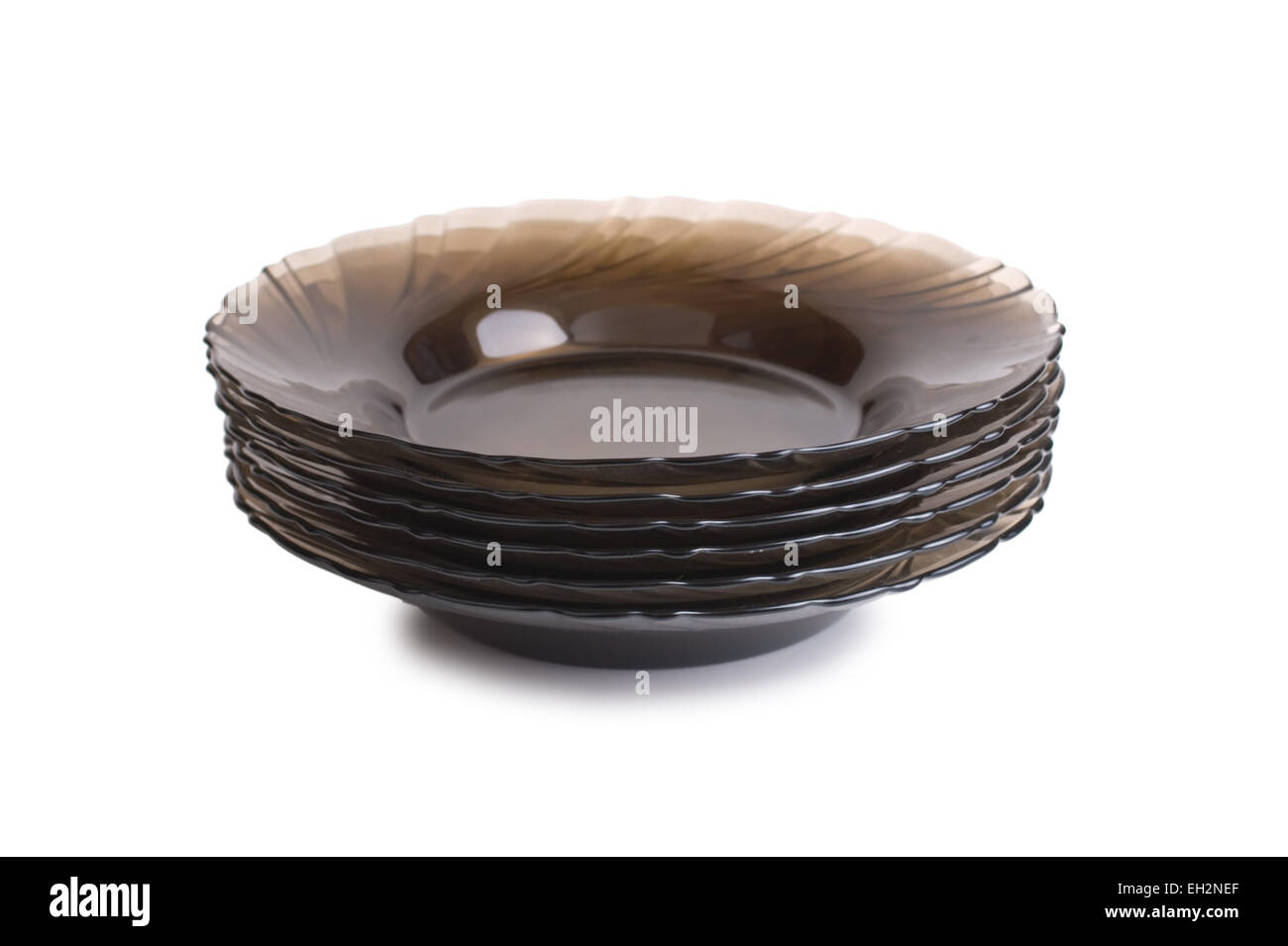 stack of brown plates isolated on a white background Stock Photo - Alamy