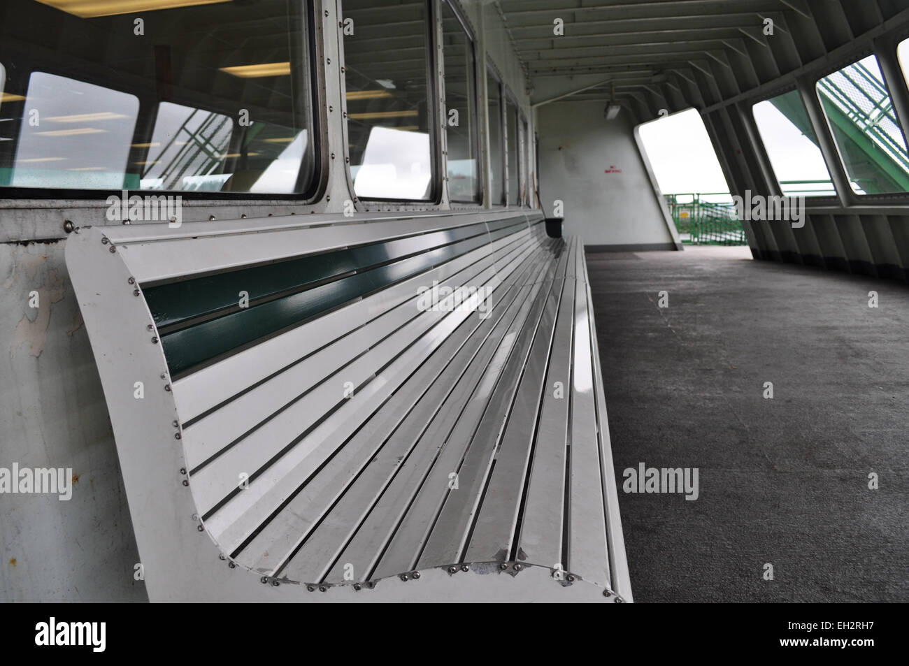 Empty bench on deck of ferry Stock Photo