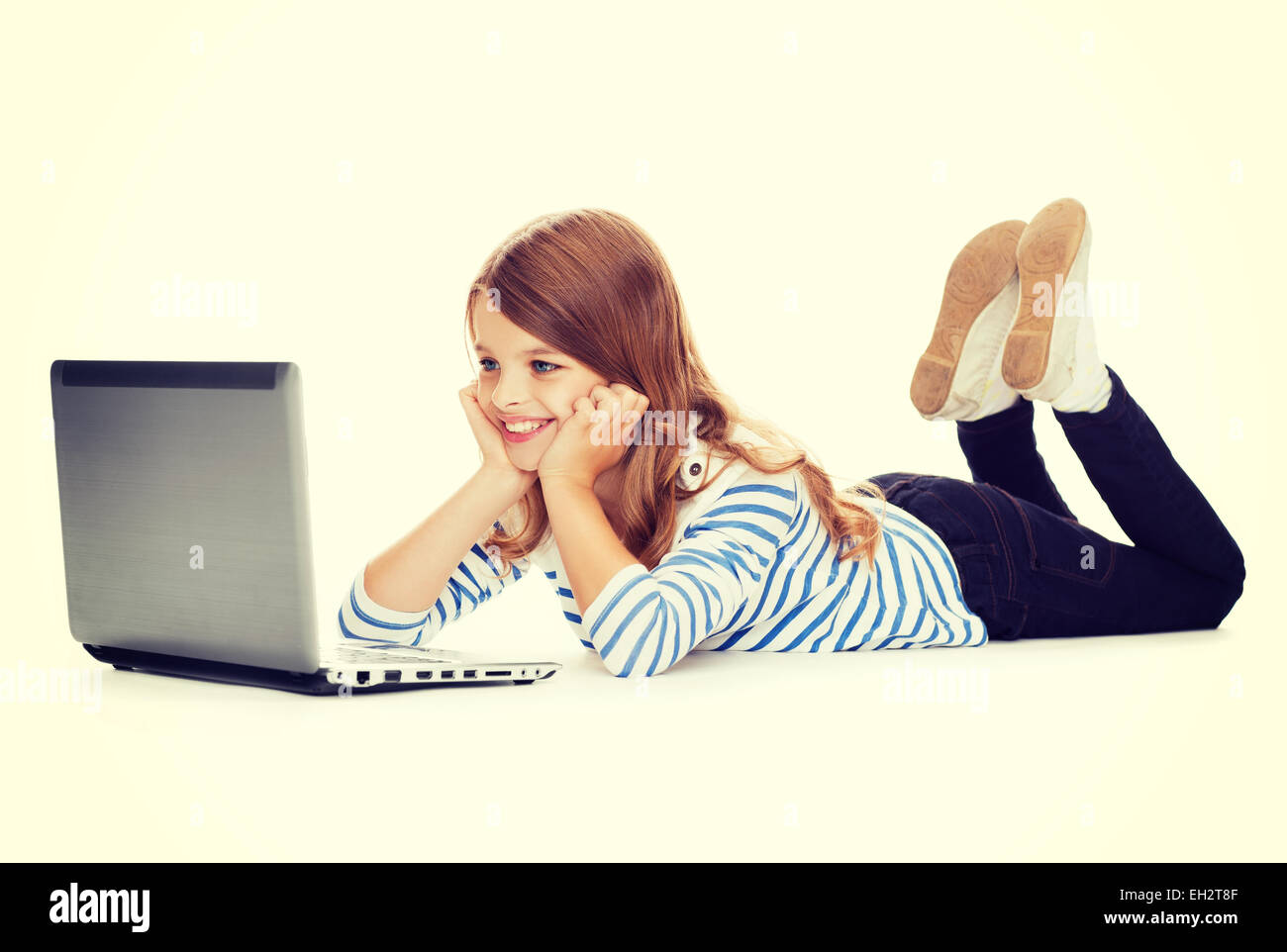smiling student girl with laptop computer lying Stock Photo - Alamy