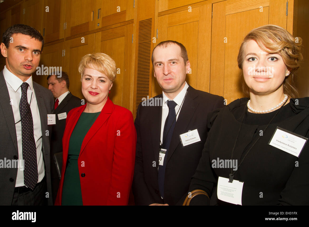 Igor Liski (L) First Deputy Minister for Foreign Affairs of Ukraine Ms. Nataliia Galibarenko, Ukraine’s Minister for Agriculture and Food Oleksiy Pavlenko, Deputy Minister for Agriculture Policy and Food Vladyslava Rutytska at the Global Friends of Ukraine photographic exhibition at the House of Commons to launch Victims of War Support Project. London, United Kingdom. 05.03.2015 Stock Photo