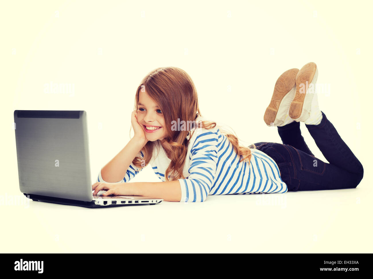 smiling student girl with laptop computer lying Stock Photo - Alamy