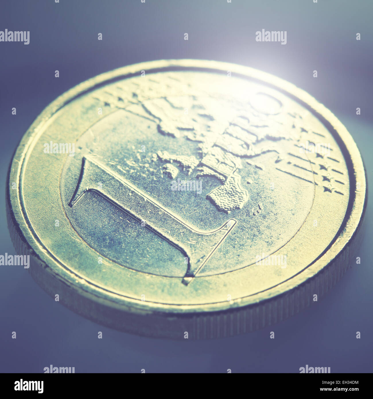 Euro coin close-up. Shallow DOF! Retro style filtred image Stock Photo