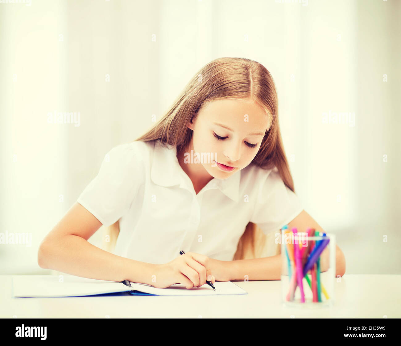 little student girl drawing at school Stock Photo - Alamy