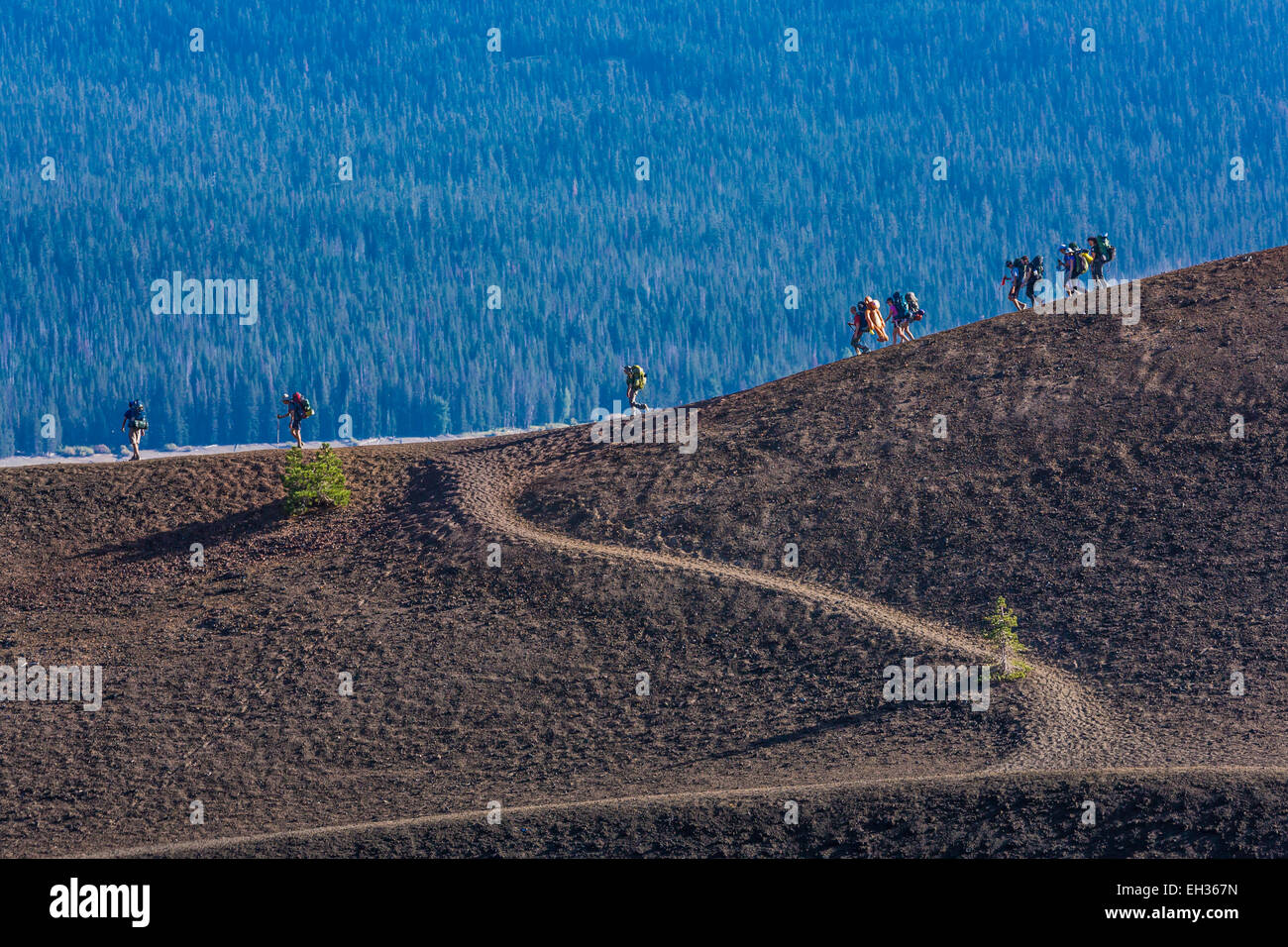 Geology students backpacking along the Cinder Cone Trail in Lassen Volcanic National Park, California, USA Stock Photo