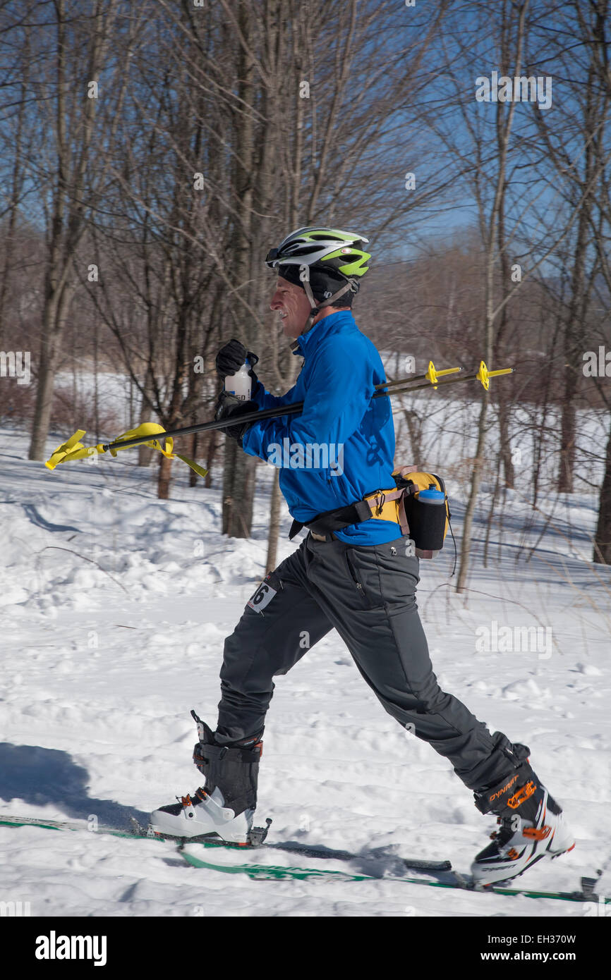 A skier at the halfway mark ready to climb  at the Thunderbolt Ski Race in March 2015 on Mount Greylock, Adams, MA. Stock Photo