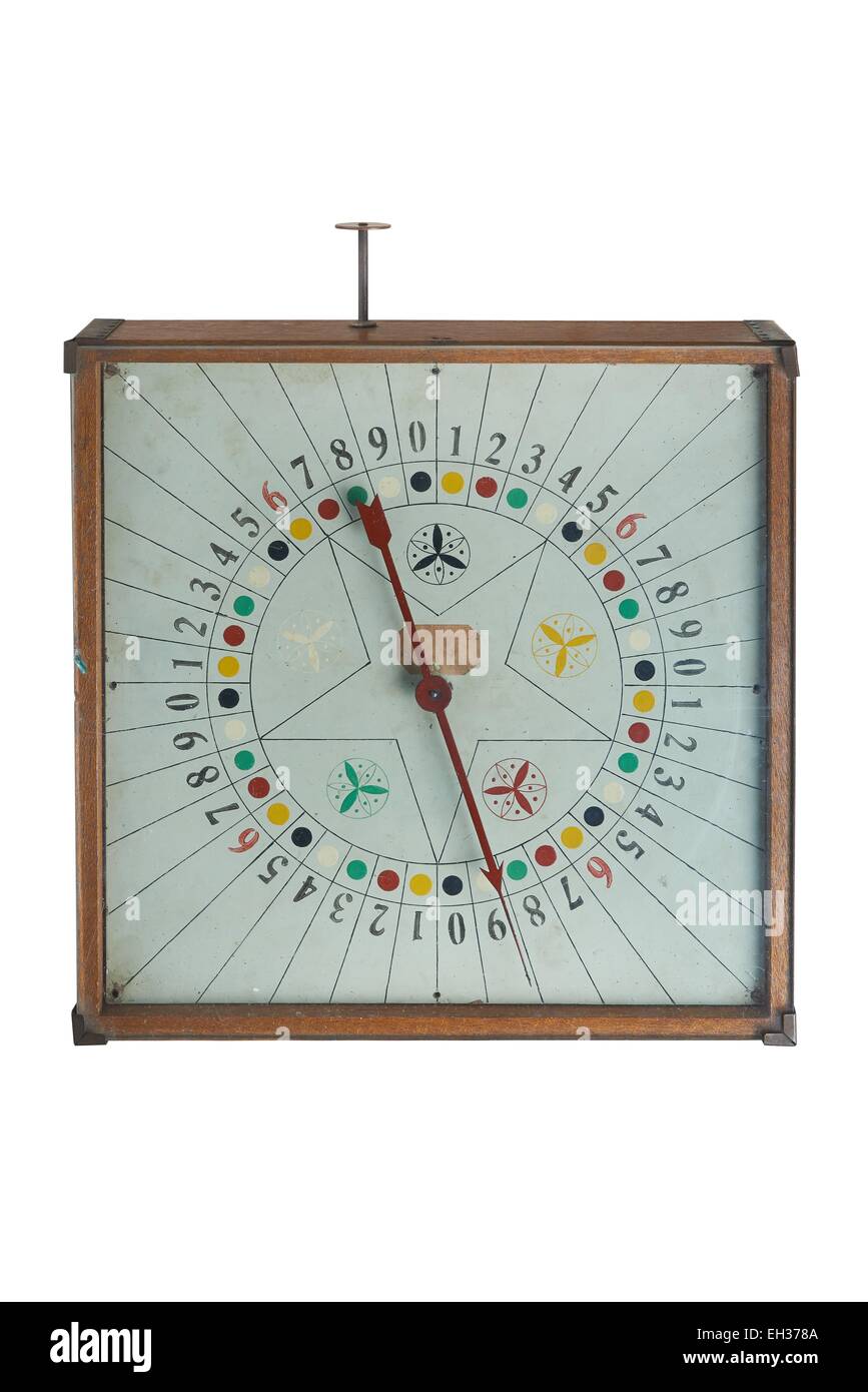 Old antic gamble spin clock on clean background Stock Photo
