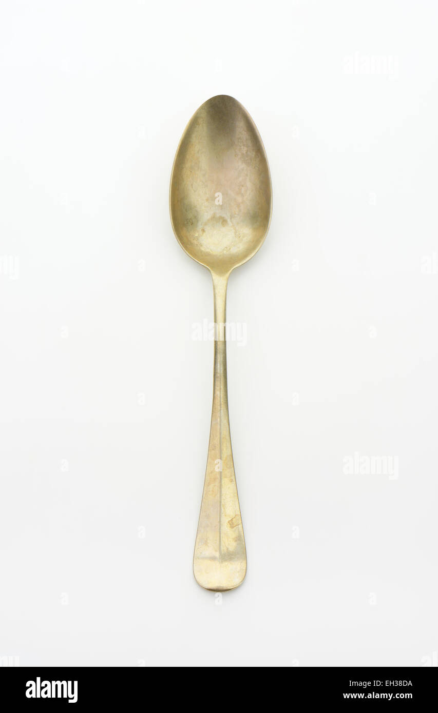 Old silver spoon on white background Stock Photo