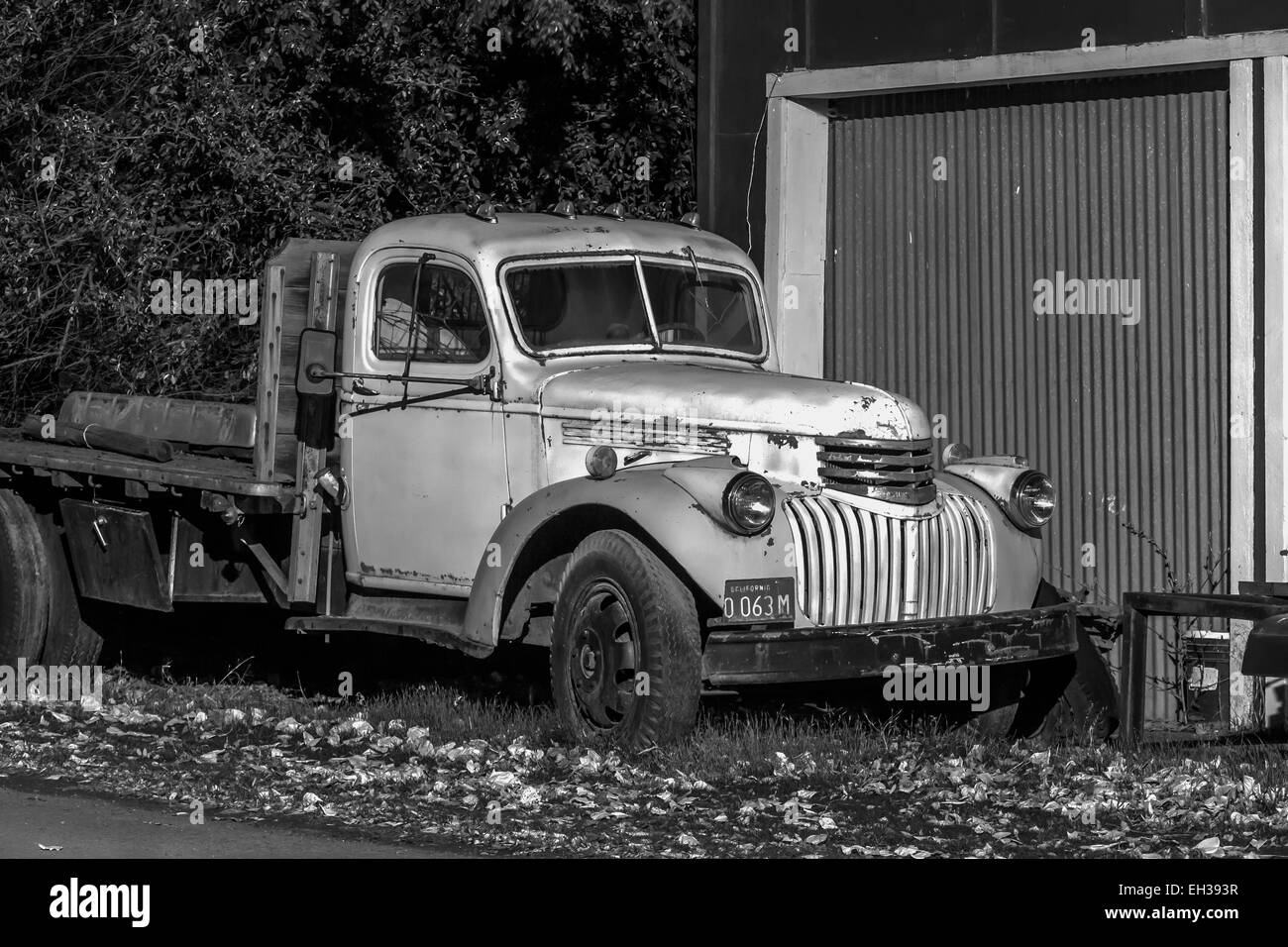 Old Chevrolet flatbed truck parked on the main street of Mitchell, Oregon, USA Stock Photo