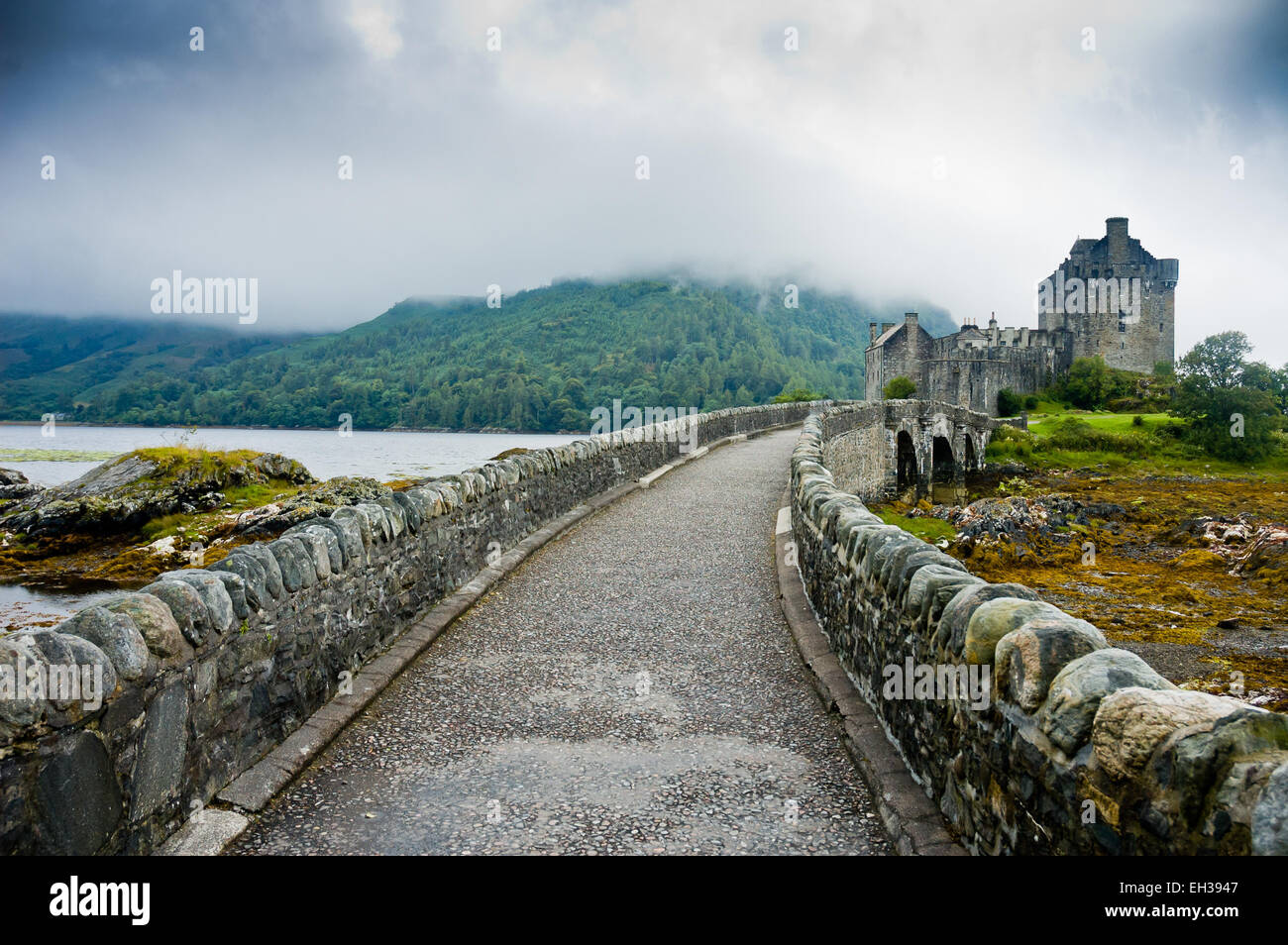 View of Eileen Donan Castle, Scotland in cloudy day with dramatic light Stock Photo