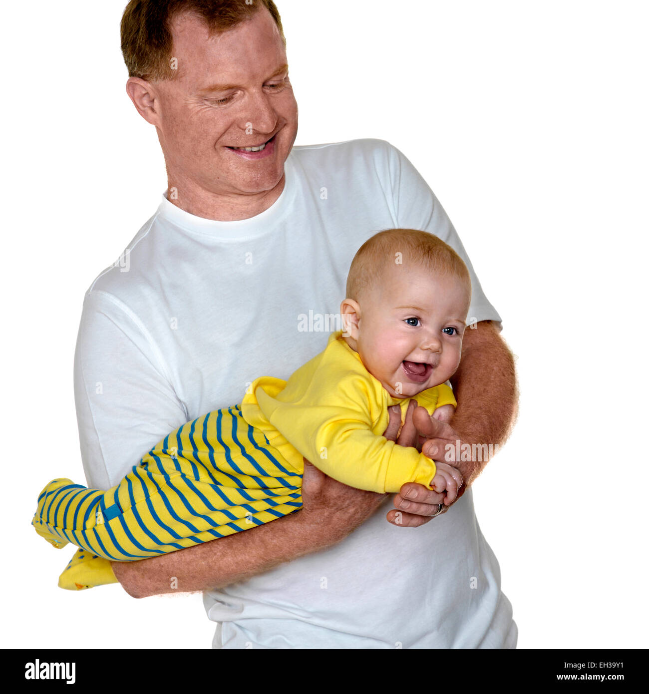 Portrait of Father Holding Baby Boy, Studio Shot Stock Photo