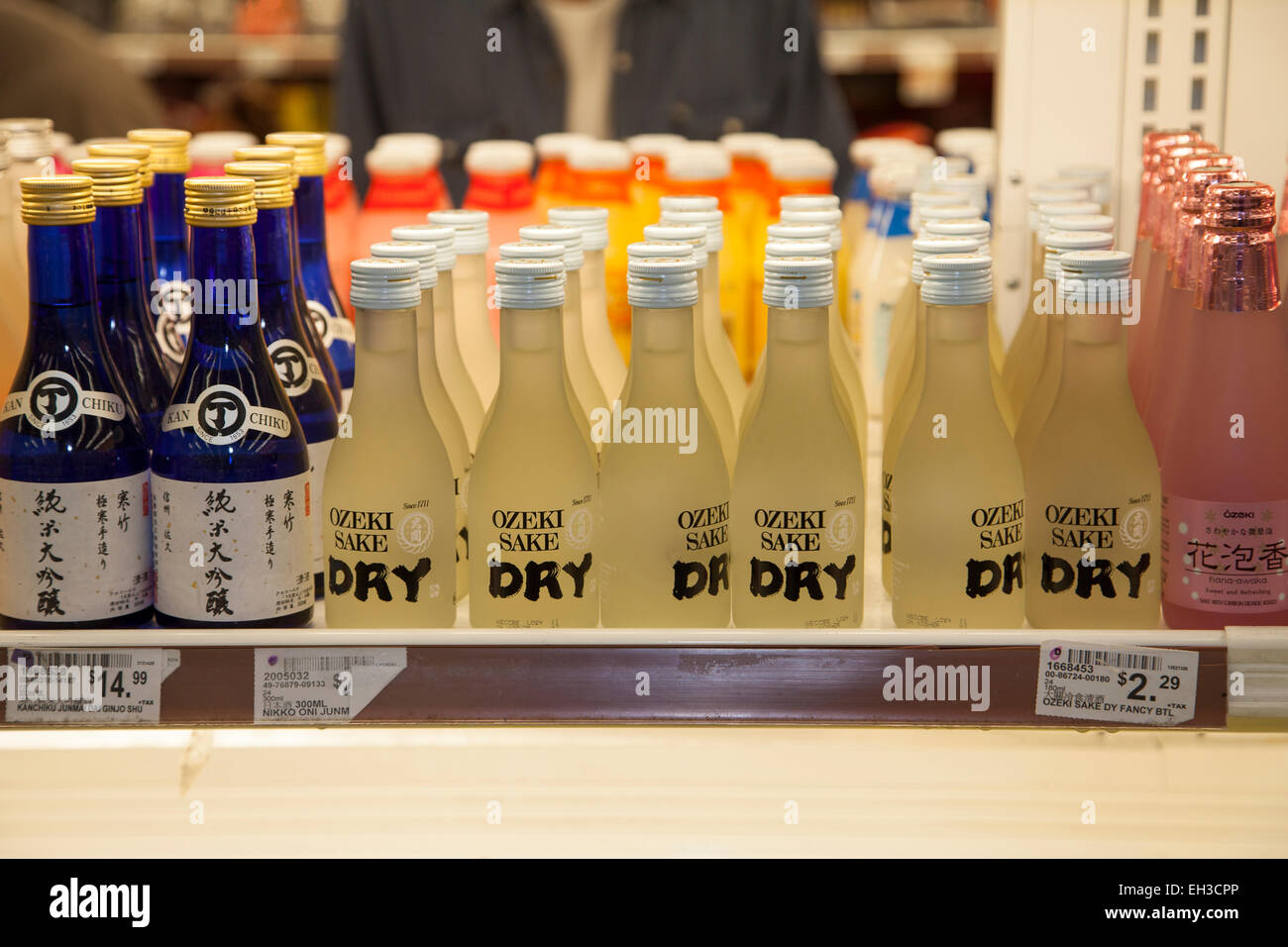 Sake bottles in an Asian market, Richmond, California, USA Stock Photo