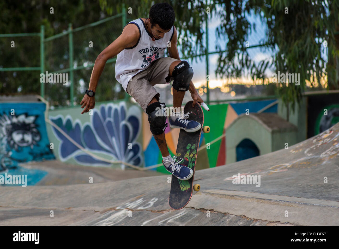 Indian skateboarder Gautham Kamath shot in the sunset at a skatepark in Bangalore, India Stock Photo