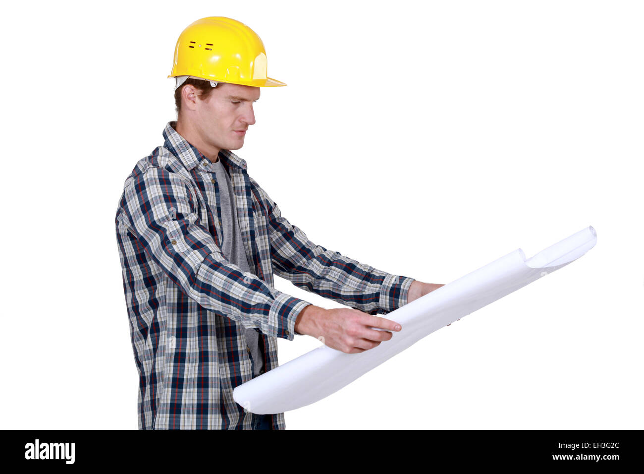craftsman looking at a blueprint Stock Photo - Alamy