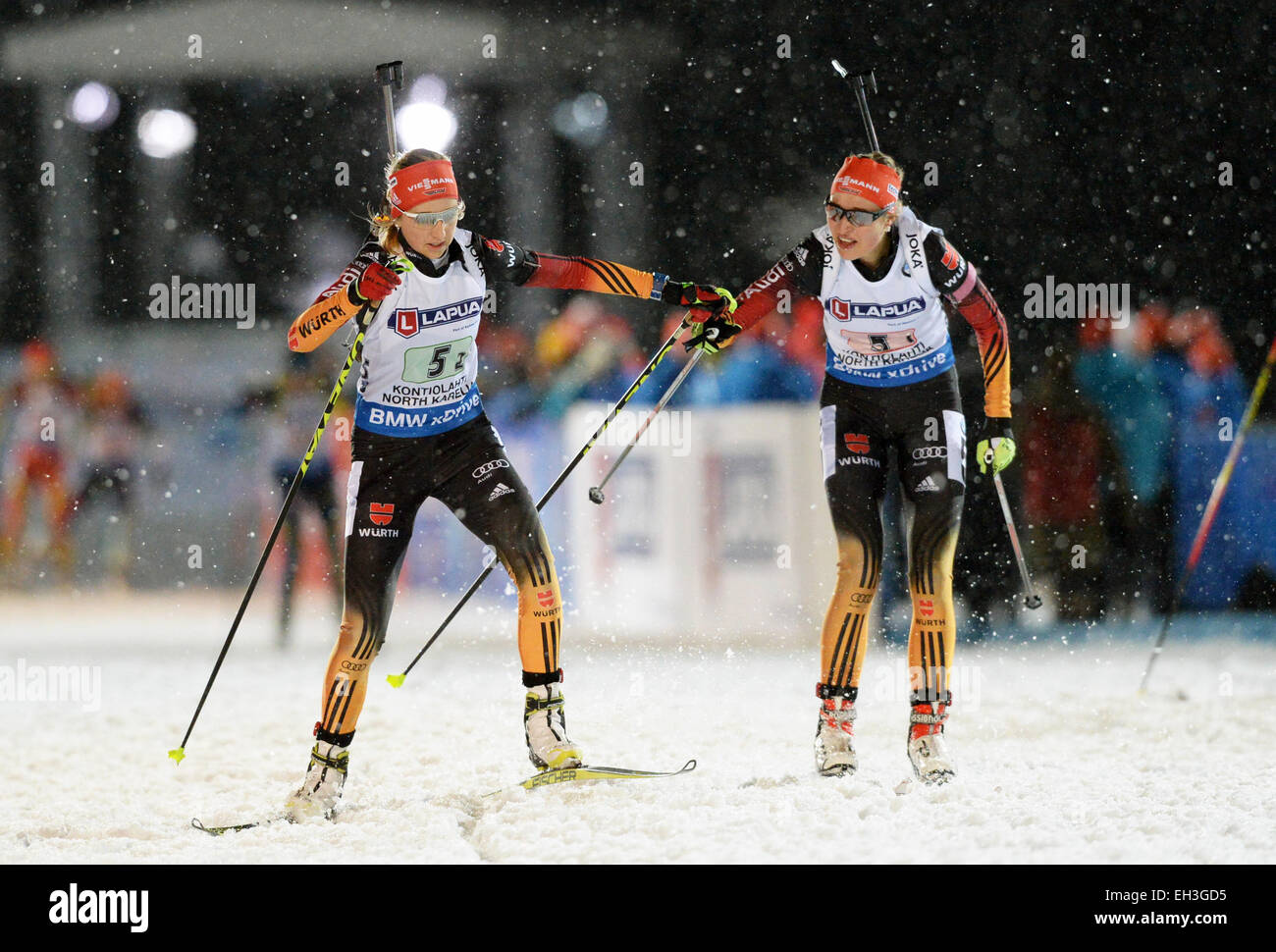 Kontiolahti, Finland. 05th Mar, 2015. Biathletes Luis Kummer (R) and Franziska Preuss, both of Germany, action during the Mixed Relay competition at the Biathlon World Championships in Kontiolahti, Finland, 05 March 2015. Photo: Ralf Hirschberger/dpa/Alamy Live News Stock Photo