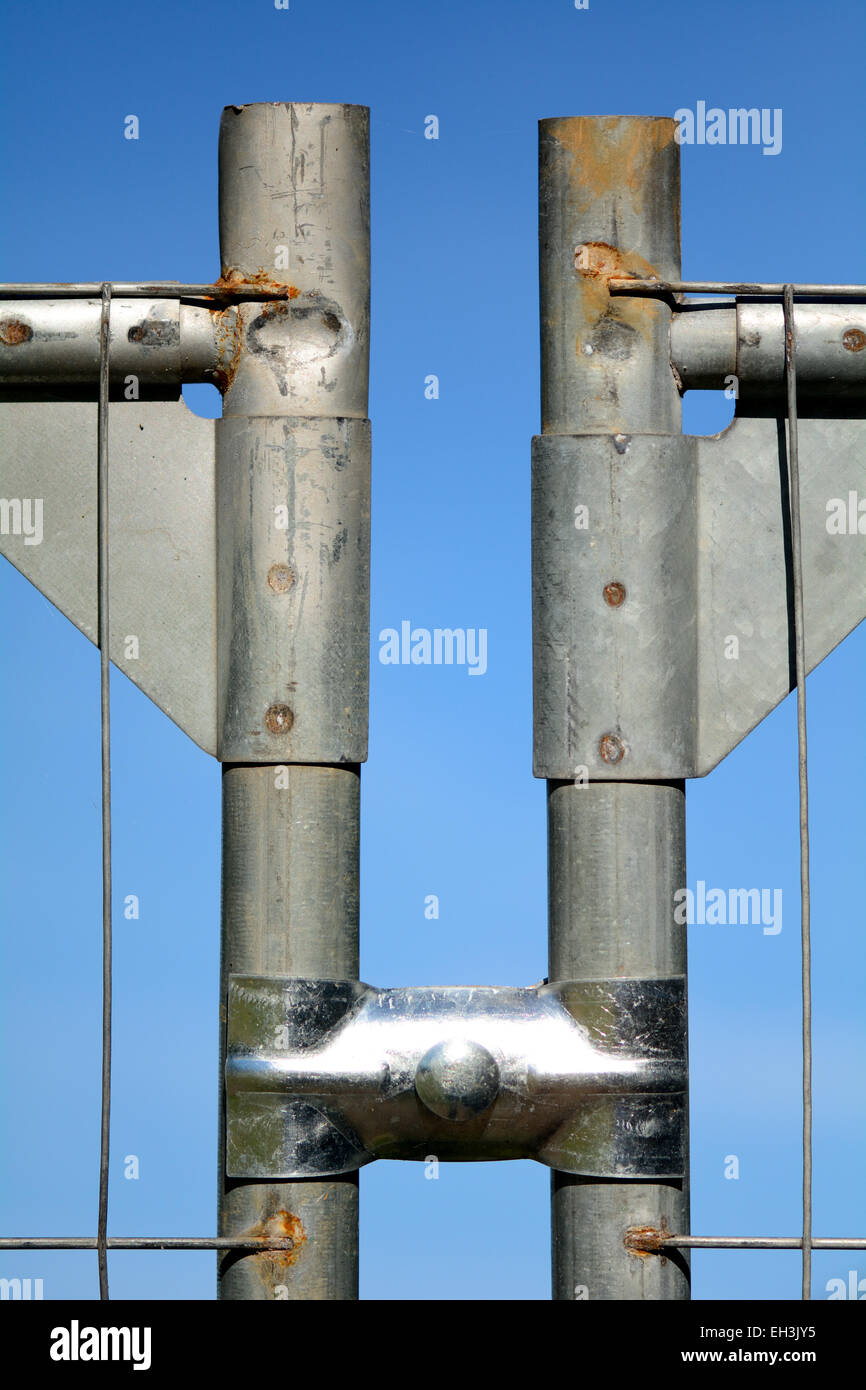 Metal fence posts with joining brace Stock Photo Alamy