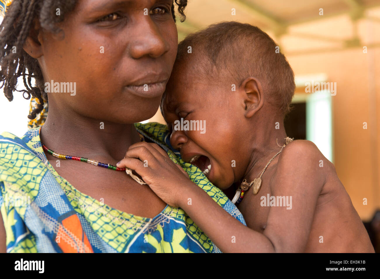 KOMOBANGAU, TILLABERI PROVINCE, NIGER, 15th May 2012: Fatimata Birma, and her son aged two, are treated at the health clinic for severe malnutition. Stock Photo