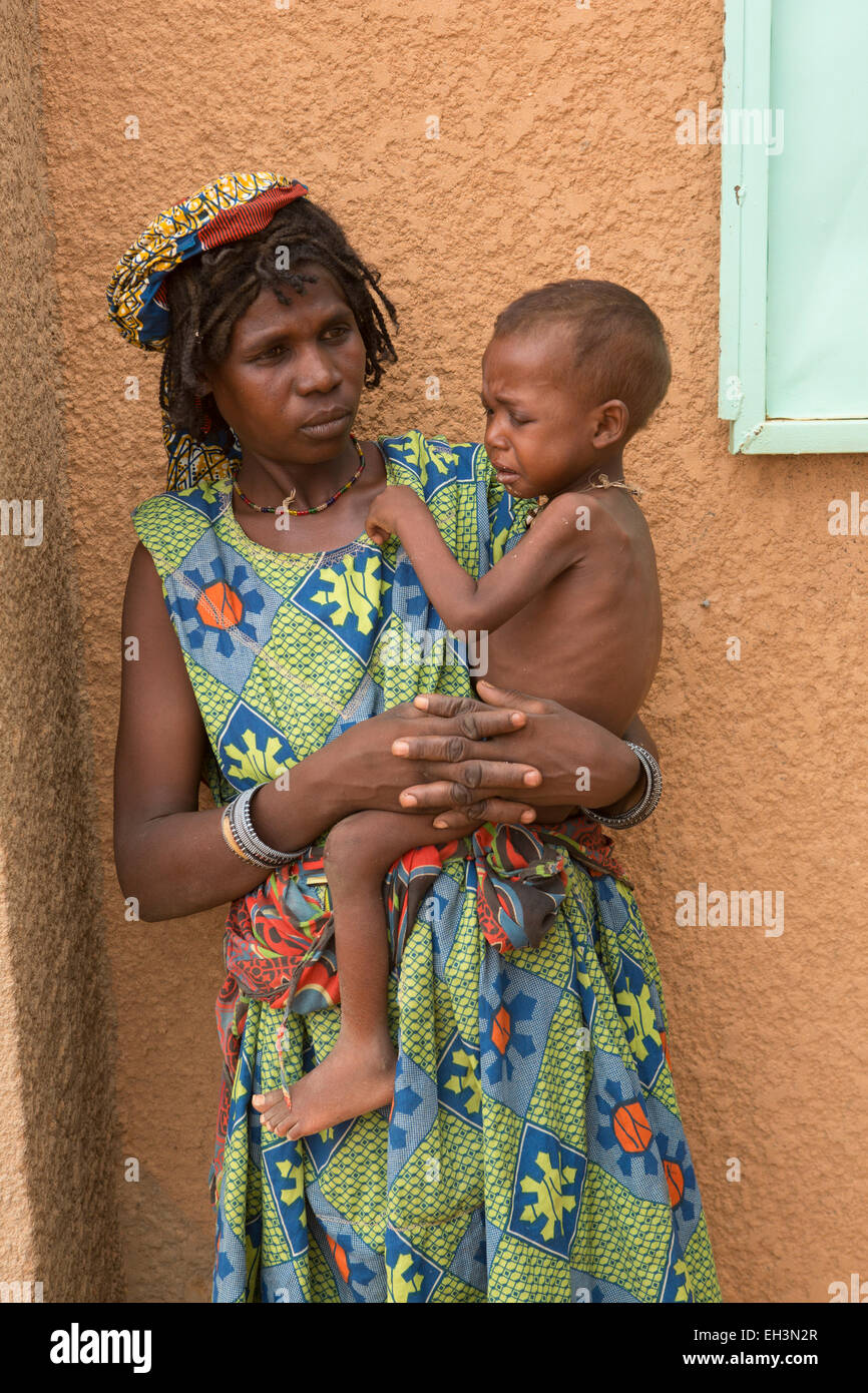 KOMOBANGAU, TILLABERI PROVINCE, NIGER, 15th May 2012: Fatimata Birma, and her son aged two, are treated at the health clinic for severe malnutition. Stock Photo