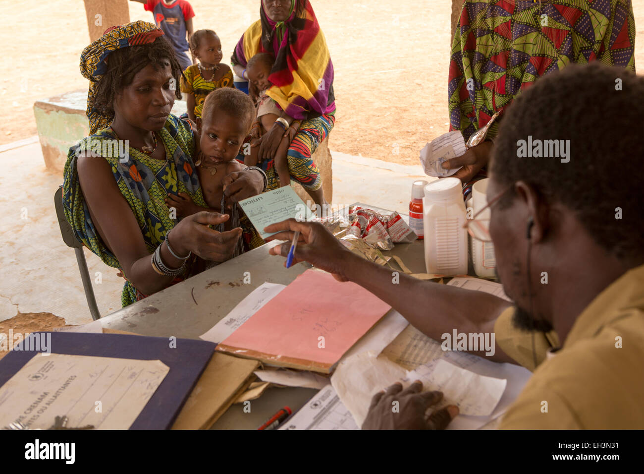 KOMOBANGAU, TILLABERI PROVINCE, NIGER, 15th May 2012: Fatimata Birma, and her son aged two, are treated at the health clinic for severe malnutition. Stock Photo