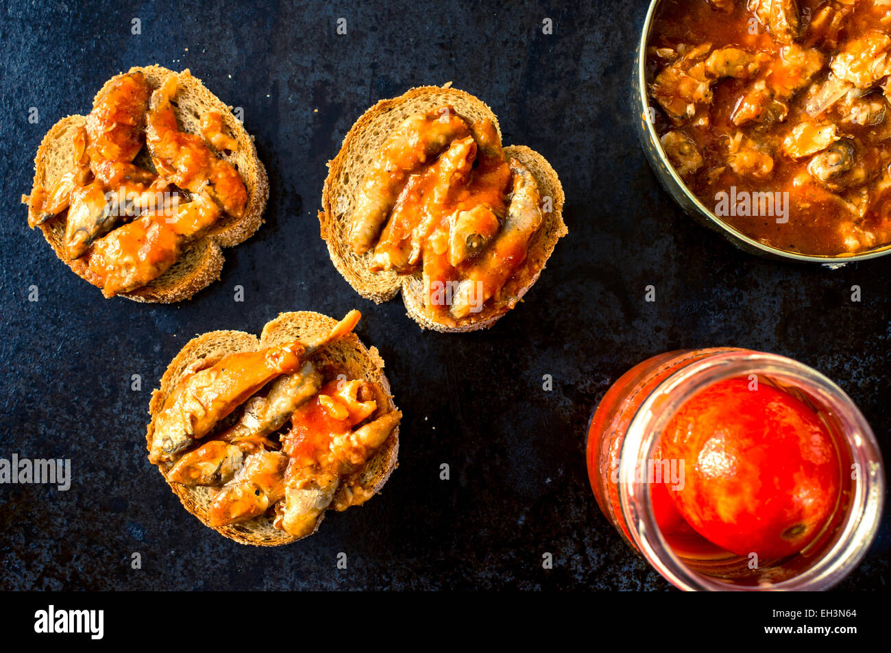 Tapas with canned fish in tomato sauce Stock Photo Alamy