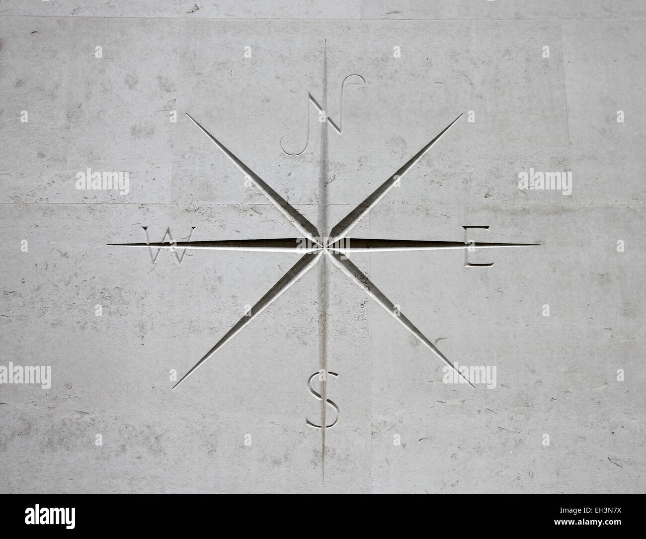 compass points on building wall Stock Photo